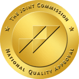 A gold seal that says the joint commission national quality approval.